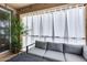 Comfortable patio seating with privacy curtains and string lights creates a relaxing outdoor space at 631 W Winchester Dr, Chandler, AZ 85286
