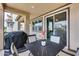 Charming patio with a table, chairs, and grill, ideal for outdoor entertaining and relaxation at 631 W Winchester Dr, Chandler, AZ 85286
