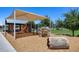 Shaded playground area with slide and climbing features for community residents at 631 W Winchester Dr, Chandler, AZ 85286
