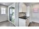 Chic wet bar area with sleek white cabinets and a black countertop, perfect for entertaining at 631 W Winchester Dr, Chandler, AZ 85286