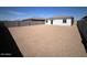 Unfinished backyard, showcasing the home's exterior, block wall, and potential landscaping space at 640 S Maricopa Rd, Florence, AZ 85132
