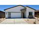 Charming single-story home featuring a two-car garage, low-maintenance landscaping, and modern architectural details at 640 S Maricopa Rd, Florence, AZ 85132