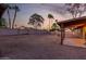 A large gravel backyard with a covered patio for relaxing at 6424 E Aire Libre Ln, Scottsdale, AZ 85254