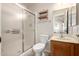 Bathroom featuring tiled flooring, glass-enclosed shower, and a vanity with mirror at 6424 E Aire Libre Ln, Scottsdale, AZ 85254
