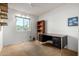 Bedroom with a neutral walls, carpet flooring, a wooden desk, and a bookshelf at 6424 E Aire Libre Ln, Scottsdale, AZ 85254