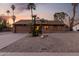 Charming single-Gathering home boasting a landscaped front yard and attached two-car garage at 6424 E Aire Libre Ln, Scottsdale, AZ 85254
