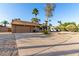 Charming single-story home featuring desert landscaping and two car garage at 6424 E Aire Libre Ln, Scottsdale, AZ 85254