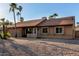 A single-story house featuring desert landscaping and a two-car garage at 6424 E Aire Libre Ln, Scottsdale, AZ 85254