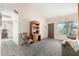 Cozy living room with plush carpet, and an open layout bathed in sunlight at 6424 E Aire Libre Ln, Scottsdale, AZ 85254