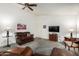 Cozy living room featuring comfortable seating, a TV, and neutral carpet at 6424 E Aire Libre Ln, Scottsdale, AZ 85254