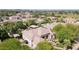 Expansive aerial view of several homes with backyard pools and lush landscaping at 6428 W Eugie Ave, Glendale, AZ 85304