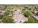 Aerial view of the neighborhood showcasing the house and the golf course at 6428 W Eugie Ave, Glendale, AZ 85304
