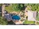 Aerial view of the backyard featuring a pool with a waterfall, manicured landscaping, and a covered gazebo at 6428 W Eugie Ave, Glendale, AZ 85304