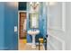 Bathroom featuring a pedestal sink, decorative mirror, and colorful walls at 6428 W Eugie Ave, Glendale, AZ 85304
