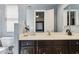 Contemporary bathroom featuring a dark vanity and light countertop at 6428 W Eugie Ave, Glendale, AZ 85304