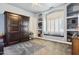 Bedroom with built-in shelving, window seat, and murphy bed at 6428 W Eugie Ave, Glendale, AZ 85304