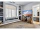 Bedroom with built-in shelving, window seat, and adjacent bathroom at 6428 W Eugie Ave, Glendale, AZ 85304