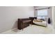 Spacious bedroom with antique piano and a teddy bear on the bed at 6428 W Eugie Ave, Glendale, AZ 85304