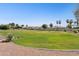 Community green space featuring a large manicured lawn and landscaping at 6428 W Eugie Ave, Glendale, AZ 85304