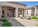 Inviting front porch with seating and views of the front yard at 6428 W Eugie Ave, Glendale, AZ 85304