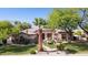 Beautiful single-story house with manicured lawn, mature landscaping, and circular driveway at 6428 W Eugie Ave, Glendale, AZ 85304