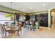 Bright kitchen with an island and bar seating that is next to an adjacent dining area at 6428 W Eugie Ave, Glendale, AZ 85304