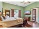 Bright main bedroom featuring hardwood floors, natural light, and a private access door at 6428 W Eugie Ave, Glendale, AZ 85304