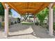Covered patio featuring a view of the garden, gravel bed, and stone columns at 6428 W Eugie Ave, Glendale, AZ 85304