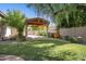 Covered patio featuring a view of the garden, gravel bed, and string lights at 6428 W Eugie Ave, Glendale, AZ 85304