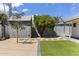 Well-maintained backyard with a storage shed, landscaping, and artificial turf, offering a low-maintenance outdoor space at 6723 E 1St Ave, Scottsdale, AZ 85251