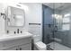 Modern bathroom featuring a glass-enclosed shower and contemporary fixtures at 6723 E 1St Ave, Scottsdale, AZ 85251