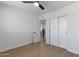 Bedroom featuring light hardwood floors, a closet, and white walls, creating a spacious and inviting atmosphere at 6723 E 1St Ave, Scottsdale, AZ 85251