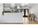 Bright kitchen area featuring a breakfast bar with pendant lighting and an adjacent dining space near the glass doors at 6723 E 1St Ave, Scottsdale, AZ 85251