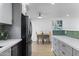 View from the kitchen showcasing a functional layout and an adjacent dining area at 6723 E 1St Ave, Scottsdale, AZ 85251