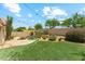 A backyard featuring a pool, desert landscaping and synthetic grass at 719 W Milada Dr, Phoenix, AZ 85041