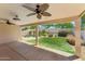 Covered patio views the landscaped backyard with a pool and a grassy area at 719 W Milada Dr, Phoenix, AZ 85041