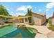 A sparkling private pool is complemented by a covered patio and a well-maintained yard at 719 W Milada Dr, Phoenix, AZ 85041