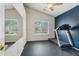 Bedroom with dark accent wall, ceiling fan and exercise equipment at 719 W Milada Dr, Phoenix, AZ 85041