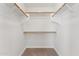 Walk-in closet features carpet flooring and wooden clothes rods at 719 W Milada Dr, Phoenix, AZ 85041