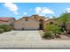 Exterior view of the front of a two-story home with a three-car garage at 719 W Milada Dr, Phoenix, AZ 85041