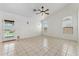 Spacious living room with tile floors, large windows, and lots of natural light at 719 W Milada Dr, Phoenix, AZ 85041