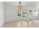 Open living area with large windows and tile flooring, ready for your personal touch at 719 W Milada Dr, Phoenix, AZ 85041