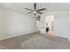 Spacious main bedroom with carpeted floors leading into bathroom with dual sinks and walk-in closet at 719 W Milada Dr, Phoenix, AZ 85041