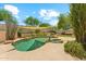 Backyard featuring a uniquely shaped pool with desert landscaping at 719 W Milada Dr, Phoenix, AZ 85041