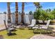 Cozy backyard lounge area with comfortable seating arrangements on artificial grass at 7510 E Larkspur Dr, Scottsdale, AZ 85260