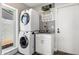 The laundry room features a stacked washer and dryer with granite countertops at 7510 E Larkspur Dr, Scottsdale, AZ 85260