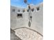 A private outdoor shower features unique mosaic tiles and an artistic wall design at 7510 E Larkspur Dr, Scottsdale, AZ 85260