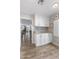 Bright pantry boasts white cabinetry, granite countertop, and stylish backsplash at 7510 E Larkspur Dr, Scottsdale, AZ 85260
