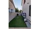 A lovely backyard space with artificial turf and game accessories at 7527 E Nestling Way, Scottsdale, AZ 85255