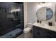 Modern bathroom featuring a glass walk-in shower, modern vanity, sink, and tiling at 7527 E Nestling Way, Scottsdale, AZ 85255